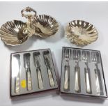 A pair of sweet meat dishes in the form of shells together with a singleton, all in silver plate,