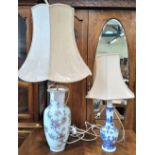 A Chinese famille rose vase with floral design 42cm and a blue and white vase 30cm, both as lamps