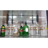 Nine glass pharmaceutical bottles. (9)