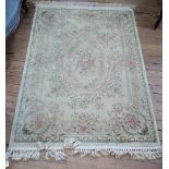 A Woollen Rug. With floral decoration.