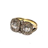 A double cluster 18c ring set with white stones. Size M