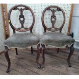 A Pair of Victorian Mahogany balloon back Chairs. Circa 1860. With over stuffed seats.