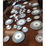 A Wedgwood Florentine Turquoise service comprising bowls, side plates, dinner plates, tea cups,