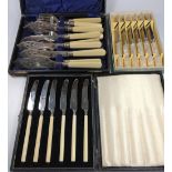 A cased set of six fish knives and forks, and a cased set of tea knives, together with a boxed set