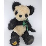 Merrythought Panda. Mohair black and white with a racing green ribbon 36cm.