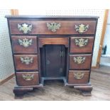 A George III mahogany Knee hole desk. Circa 1760. Fitted with a central drawer above a recessed