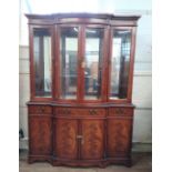 A Large Mahogany Display Cabinet. Modern. Fitted with a pair of glazed doors enclosing glass