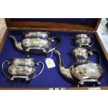 A Silver Plated Tea and Coffee Set of Four Pieces Within a Fitted Oak Case