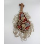 A Late 19th century Pearl Wall Hanging Decorated with Glass Beads and Pearl on a Red Material Ground