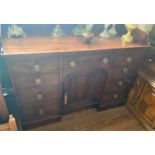 A George III Mahogany Serving or Sideboard. Circa 1800. The top with a splash back. Fitted with