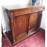 A Victorian Mahogany Chiffonier. Circa 1850. With a pair of cupboard doors flanked by columns.