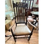 A Early 20th century oak Elbow chair