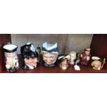 Seven Royal Doulton character jugs including The London Bobby and Athos (7)