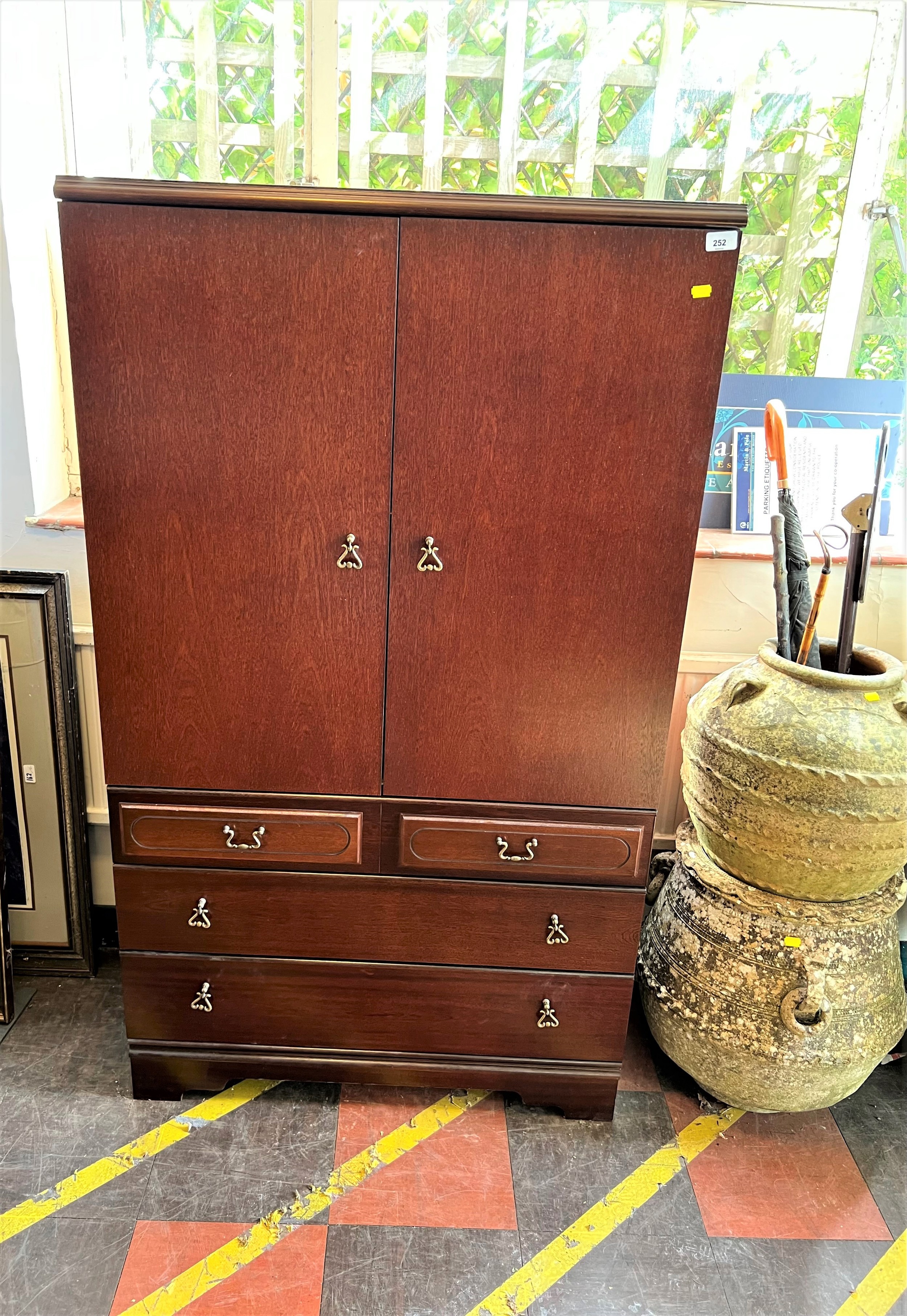 A Meredew Cupboard. 20th century. With makers label. 150cm x 88cm x 38cm.