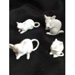 Four white porcelain mice