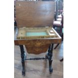 A 19th century burr walnut sewing table with marquetry inlay.