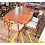 A Macintosh teak Dining room table and chairs. Circa. Mid 20th century. 74cm x 91cm x 152cm.