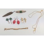 A miscellaneous collection of costume jewellery including earrings, necklaces, brooches, etc.