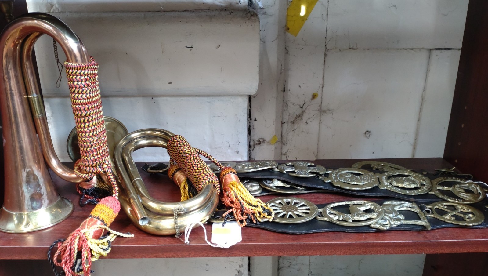 A brass Royal Welsh Fusiliers bugle (lacks mouthpiece), a copper and brass bugle and eleven horse