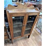 An Oak Two Door cabinet. Circa 1900. 114cm x 72.5 cm x 23cm.