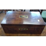 A 19th century walnut-oak writing slope with a brass inlay.