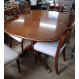 A Modern Mahogany Dining Table and 6 chairs. 20th century.