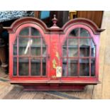 A Red Lacquer Wall Cabinet. Circa 1920. With chinoiserie  decoration. 72cm x 89 cm x 24cm.