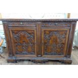 A Victorian Walnut Sideboard. Circa 1890. Ornately carved throughout.