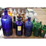 A collection of pharmaceutical glass bottles and four stoneware items. (34)