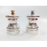A boxed pair of pepper mills.