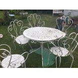 A Wrought Iron Garden Table & 5 Chairs. Table 70cm (h), 95cm diameter.