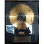 John Lennon: Imagine. This 24kt gold plated LP and original section of the doors of Tittenhurst, the