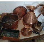 A copper framed hexagonal mirror 42cm, eight copper wares including coal bucket, jug and warming