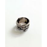 A white gold diamond ring designed by Marco Bicego to form six half eternity rings.