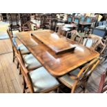 WITHDRAWN A Reproduction Yew Wood Georgian Style Dining table and 6 chairs. 20th century.