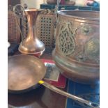 A large copper bucket with applied brass feet and brass decoration 50cm high (with handle raised)