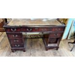 A 20th century Pedestal Desk. With leather inset top.