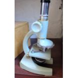 A Regent cast metal microscope 75x-300x-600x in wood box
