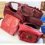 A Burgundy Snake Skin Effect Lady's Handbag. With black and white gingham interior, with two