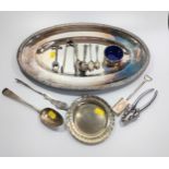 A collection of silver plated items, including an oval tray, a pair of nut crackers , an open