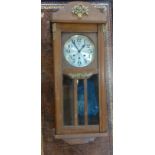 An Oak cased Chiming Wall Clock. circa 1930.