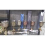 Six Indian brass goblets, Waterford cake slice and cake tongs. (8)