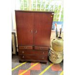 A Meredew Cupboard. 20th century. With makers label. 150cm x 88cm x 38cm.