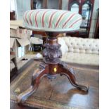 A Victorian Mahogany Piano stool. With revolving seat. On three cabriole legs with scroll feet. 46cm