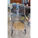 An Antique Elm and Beech Elbow chair. 19th century. And three other similar chairs.