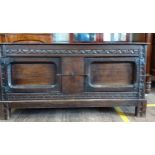 An Early 18th century Coffer. With stylised leaf carving. On stilt feet. 61cm x 122cm x 43cm.