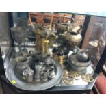 A pewter dish and small tankards, brass kettle, two hods, jug and three horse brasses.