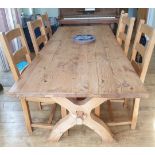 A Pine Refectory table. 20th century. With X frame supports. (74 x 210 x 90cm) and 6 dining chairs.