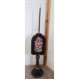 An early Victorian Mahogany Pole screen. Circa 1840. With gross point tapestry screen. 153cm tall.