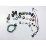 A collection of 925 silver rings set with turquoise and other gem stones. (Some silver marks